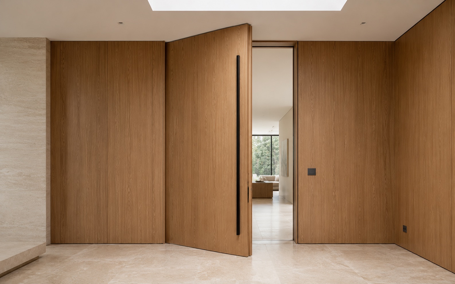 Minimal oak pivot flush door in a calm interior